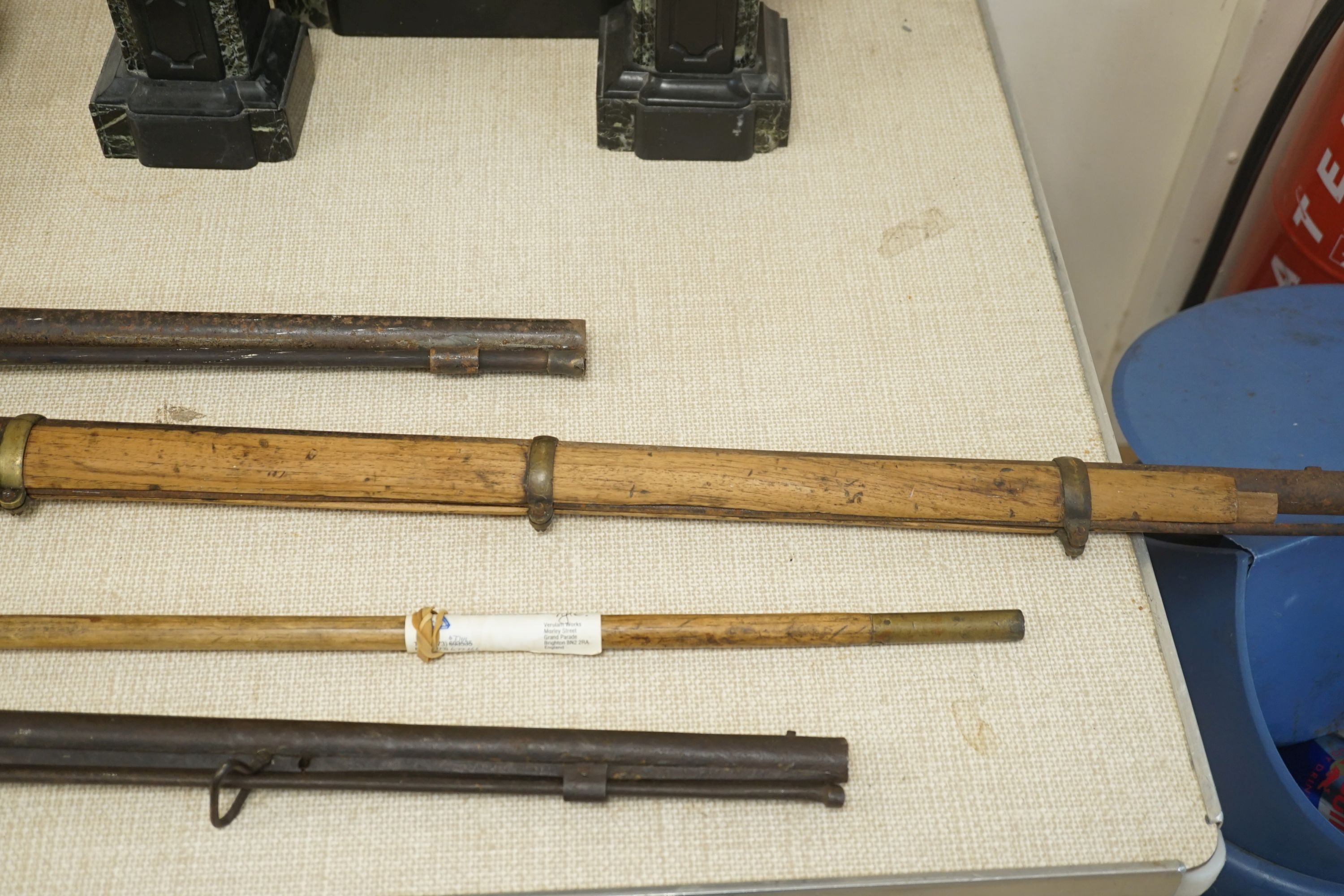 Three 19th century percussion rifles, (each in need of restoration), and a Belgian ramrod, longest 134 cms.